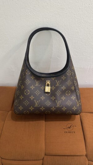 Pre-Owned/ Pre-Loved/ Second-Hand Louis Vuitton (LV) The Drop PM, Bag in Monogram, Black leather Trim Color, 28 x 15 x 12 cm Size, Front View