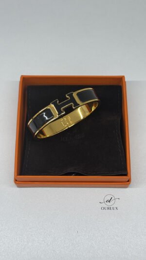 Pre-Owned/ Pre-Loved/ Second-Hand Hermes Clic H Bracelet, Bracelet in Black, Gold Hardware Color, PM (16cm wirst or smaller) Size, Front View