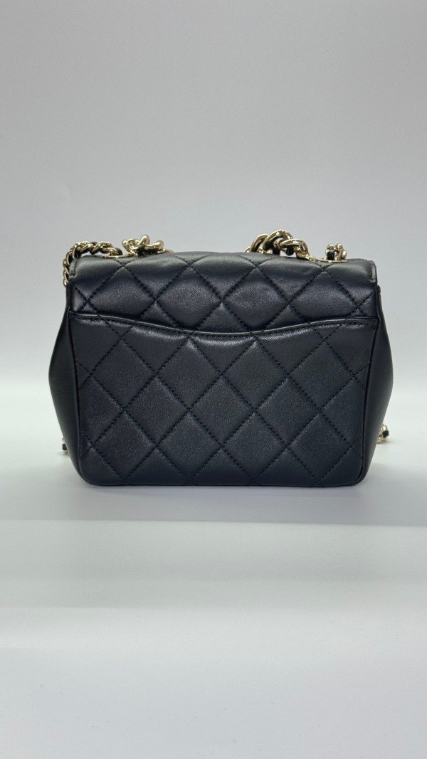 b202501562-chanel-seasonal-flap-3 Chanel | Studded Logo Mini Flap
