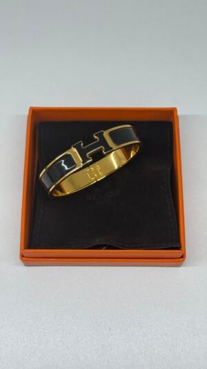 b202506586-hermes-clic-h-bracelet Pre-Owned/ Pre-Loved/ Second-Hand Hermes Clic H Bracelet, Bracelet in Black, Gold Color, PM (16cm wrist or smaller) Size, Front View