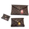 Louis Vuitton (LV) | Kirigami Pochette, Vivienne Holiday Collection