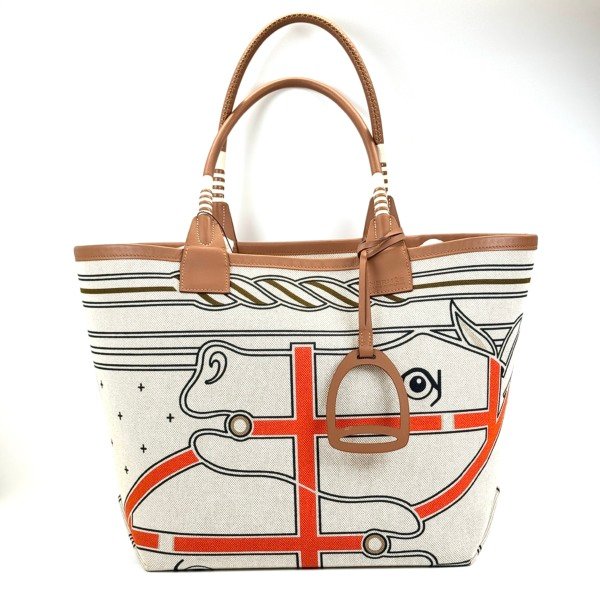 b2026061100-hermes-steeple-28-toile-canvas Pre-Owned/ Pre-Loved/ Second-Hand Hermes Steeple 28 Toile Canvas, Bag in Gold Swift Leather Handles, Ecru/Multi-Colour Canvas Color, L 28 x H 28.5 x D 18 cm Size, Front View